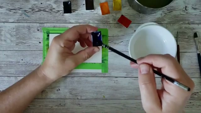 Présentation du matériel et du setup avec le scotch de masquage posé sur le papier, la bande plus large en bas, et les couleurs prêtes à être utilisées pour le challenge 5 minutes.