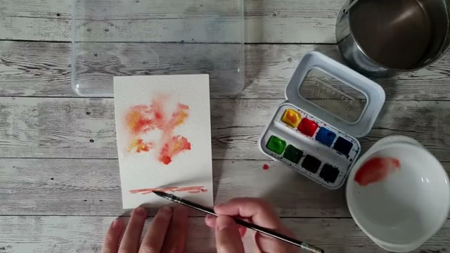 Travail du sol en mouillé sur sec, étirement de la matière avec de l'eau et le plat du pinceau dans la partie basse non vaporisée du papier