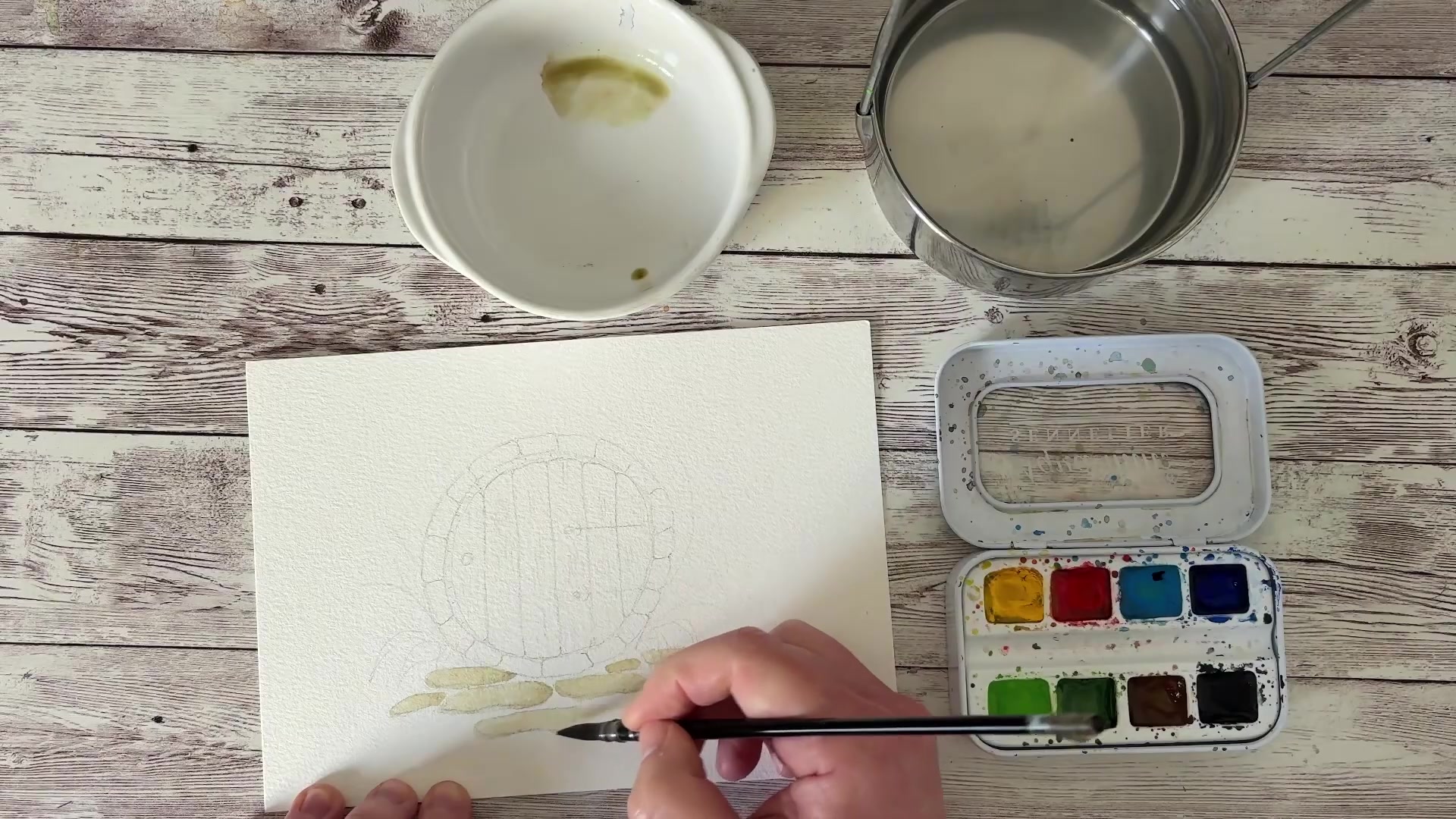 Mise en couleur des pierres avec le mélange terre d'ombre et vert anglais, texture du papier coton visible